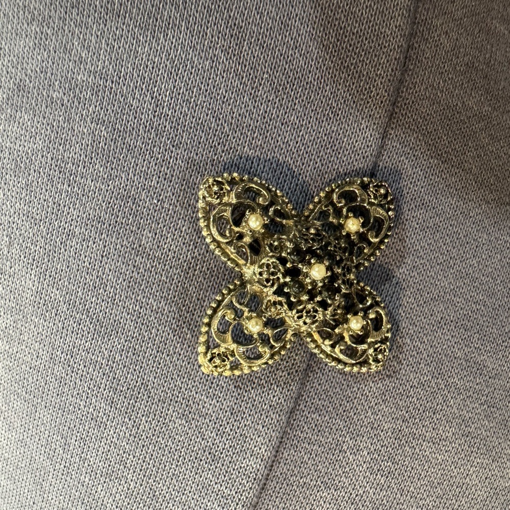 Gold Filigree Brooch on Gray Fabric - Picture 2 of 3